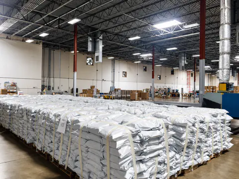 Large floor area filled with individually packaged white garments