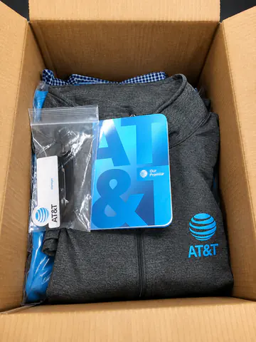 Branded kit containing apparel, accessories, and a gift card