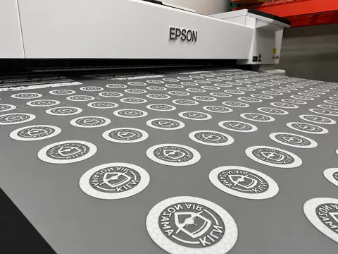 Direct-to-film printer producing a sheet of full-color transfers