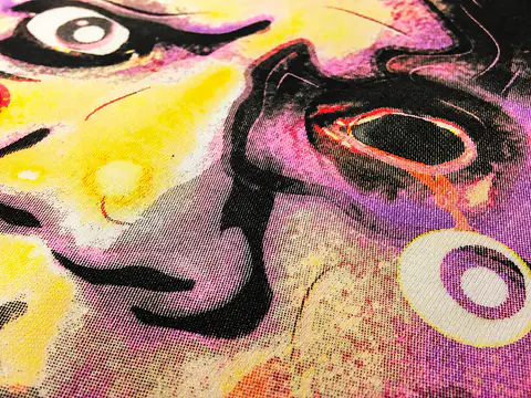 Close view of a colorful screen print with fine registration