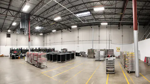 Clean production workspace with art and prepress equipment