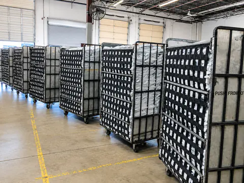 Carts filled with individually bagged finished orders
