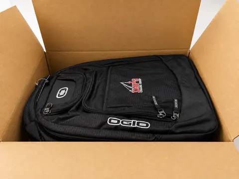 Open branded kit featuring a backpack and coordinated items